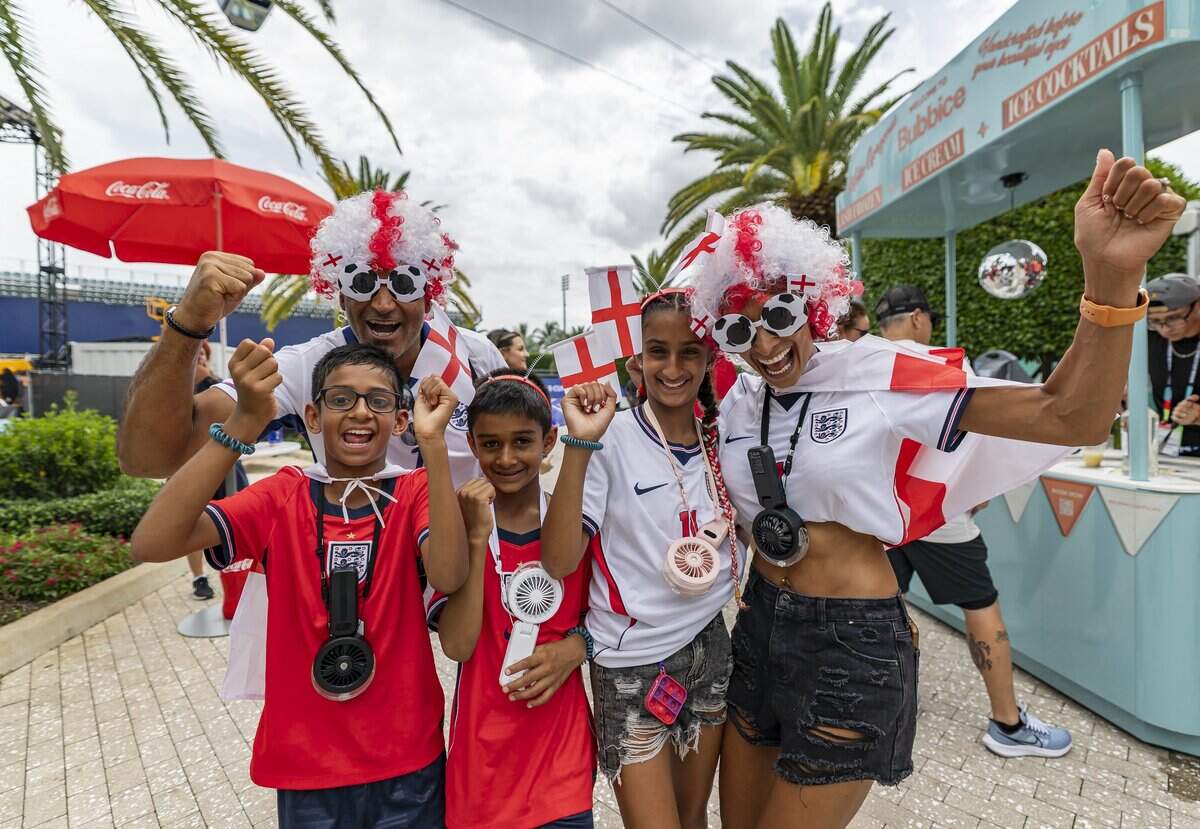 Jasdeep Ladhar, his wife, Balinder Ladhar, and their kids (from left to right) Zac Ladhar, 7, Arian Ladhar, 9, and Isla Ladhar, 11, cheer as they arrive to watch a FIFA World Cup 2026 Quarter Final soccer match between England and Norway at Hard Rock Stadium (Miami Stadium) on Saturday, July 11, 2026 in Miami Gardens, Fla.