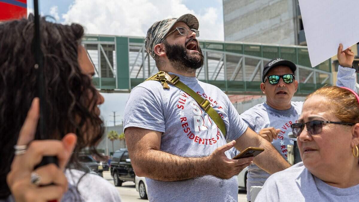 From left, Mariana Ochoa, Carlos Macias, Hernan Martinez and Maricela Vinales protest on the street near County Commissioner Raquel Regalado’s office in Coconut Grove on Wednesday, July 1, 2026.
