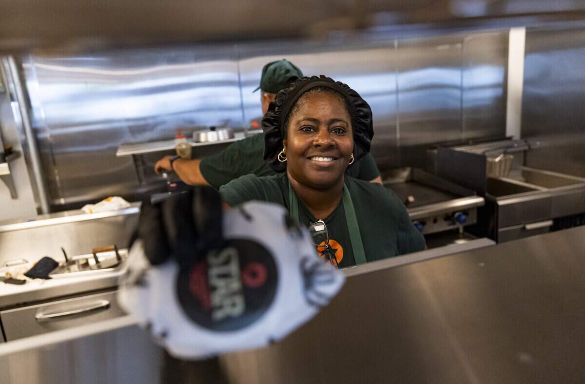 Star Burger team leader Naybi Pardo prepares a burger at the restaurant on Tuesday, July 28, 2026 in Miami, Fla.