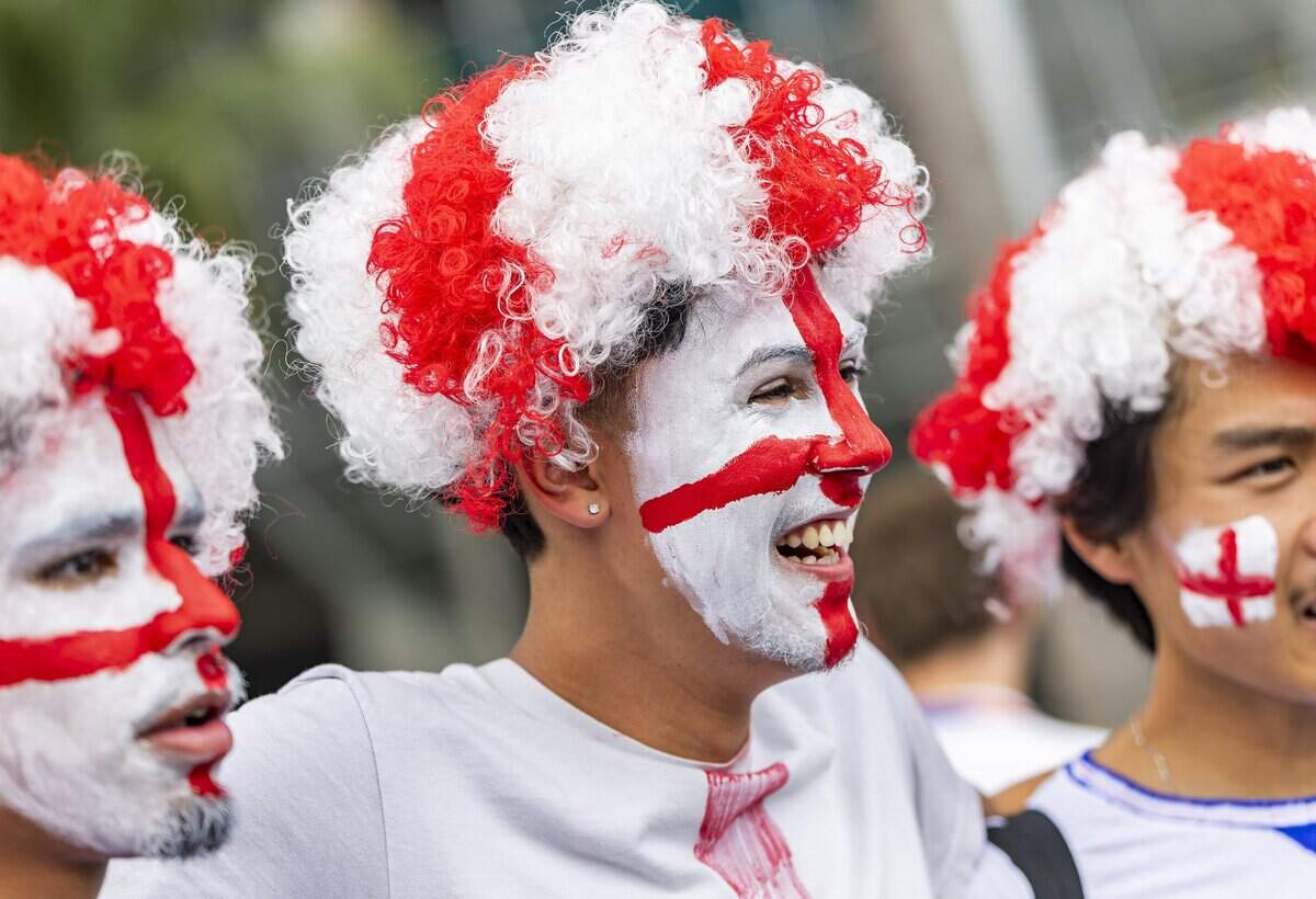 England fan Andrew Ruiz, center, reacts as he arrives to Hard Rock Stadium (Miami Stadium) ahead of his team's FIFA World Cup 2026 third-place soccer match against France on Saturday, July 18, 2026 in Miami Gardens, Fla.