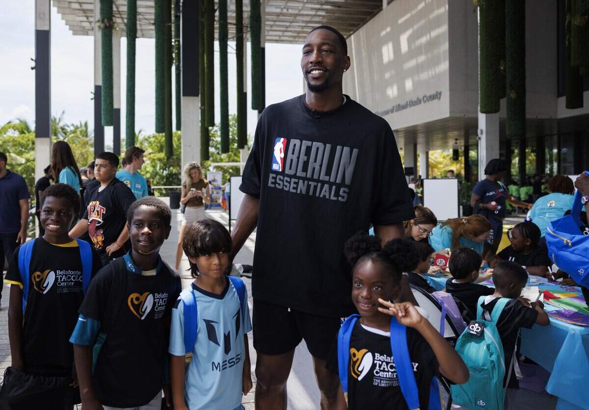 Bam Adebayo, center, poses with kids during Adebayo's 2026 Back to School Program, on Tuesday, July 28, 2026, at Pérez Art Museum Miami in downtown Miami, Fla.