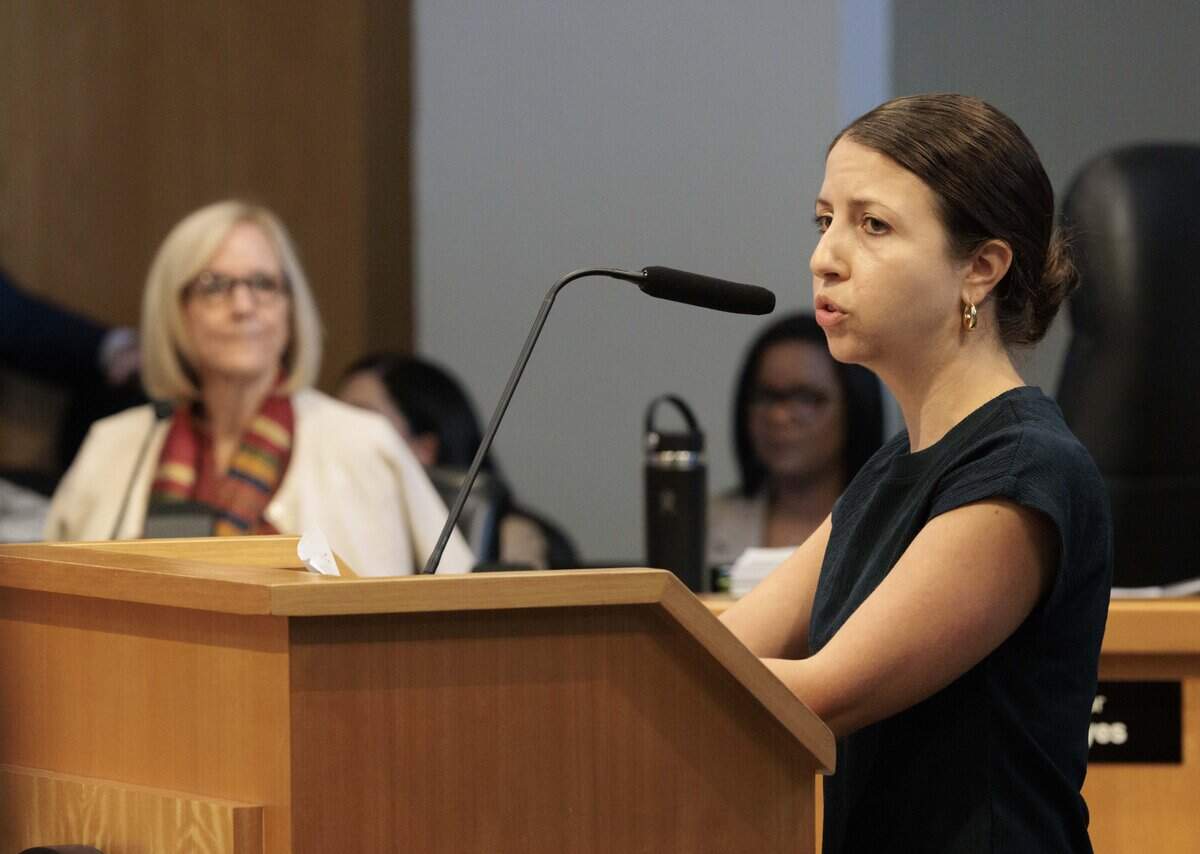 Elena Kasparis, who works with the Mary Brickell Foundation, reads a letter from Beatrice Brickell, the great granddaughter of Mary Brickell, and Mayor Eileen Higgins listens during the public comment period of a Miami city commission meeting on Thursday, July 23, 2026, at Miami City Hall in Coconut Grove.