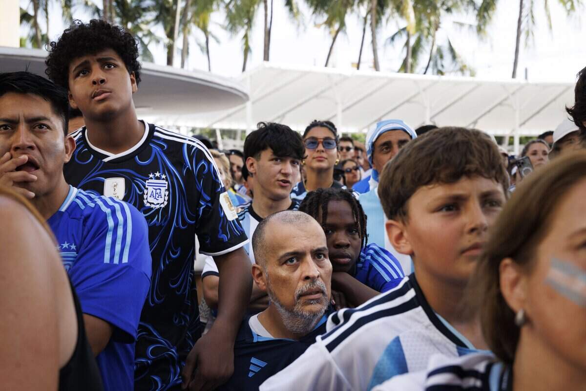 A family of Argentina fans watch the 2026 FIFA World Cup Final at a watch party on Sunday, July 19, 2026, at the Miami Beach Bandshell in Miami Beach, Fla. Spain won against Argentina 1-0 in extended time.