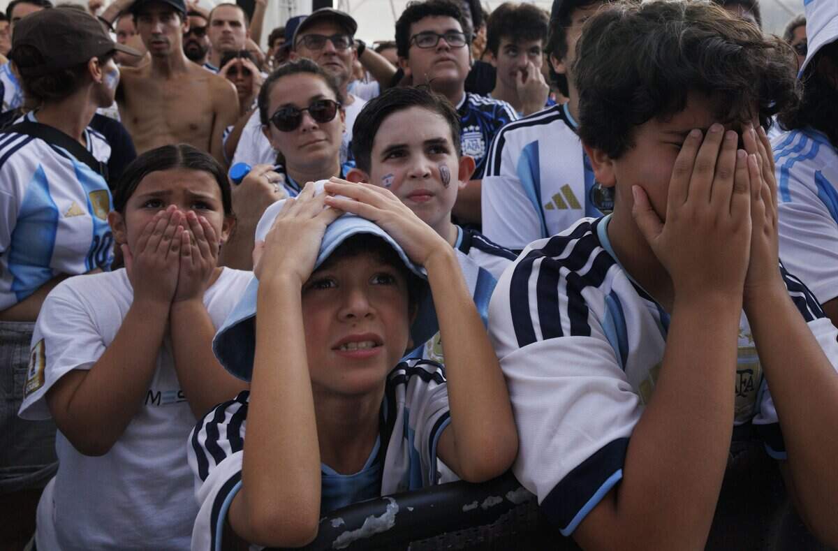 Argentina fans react to a call against their team during a watch party for the 2026 FIFA World Cup Final between Argentina and Spain on Sunday, July 19, 2026, at the Miami Beach Bandshell in Miami Beach, Fla. Spain won 1-0 in extended time.