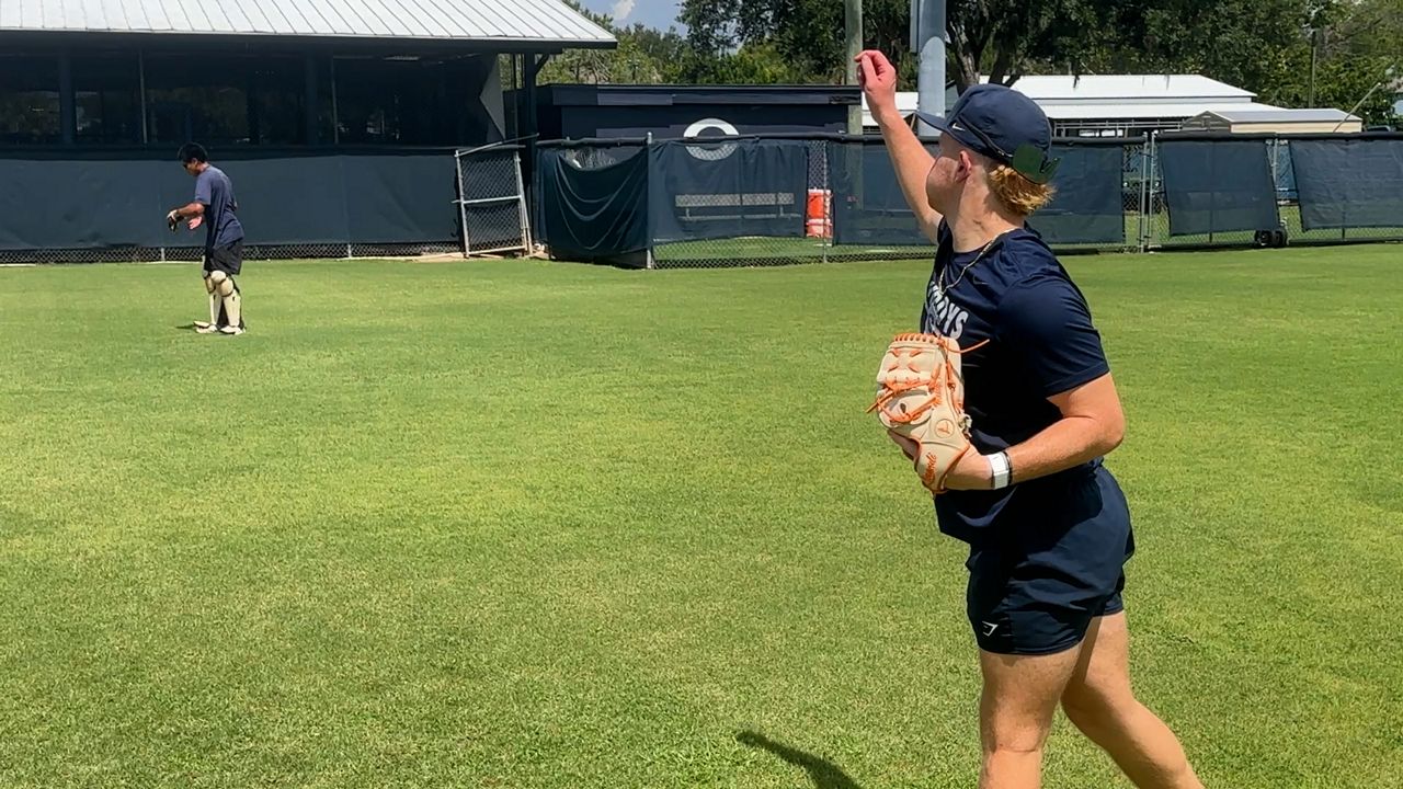 Gaither High pitcher Mathew Altman (right) throw with catcher Jose Gutierrez. (Spectrum News image)