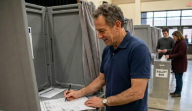 man at ballot booth