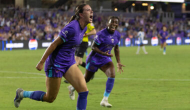 Image of Julie Doyle celebrating her winning goal against Chicago as Nicole Payne cheers her on.