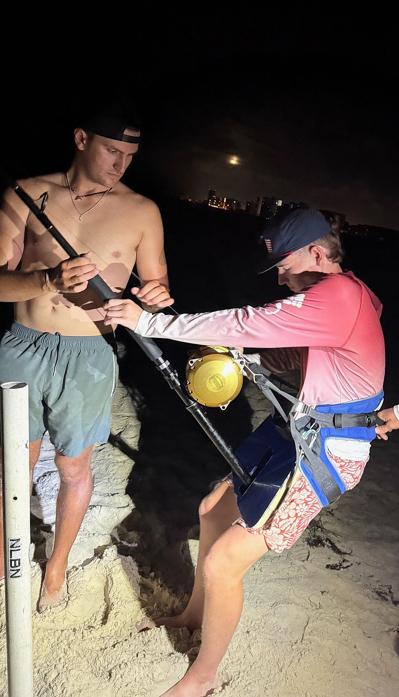 Patterson Johnson battles a shark in the surf at night near Pensacola, Fla.
(Photo submitted by Jordan Johnson)