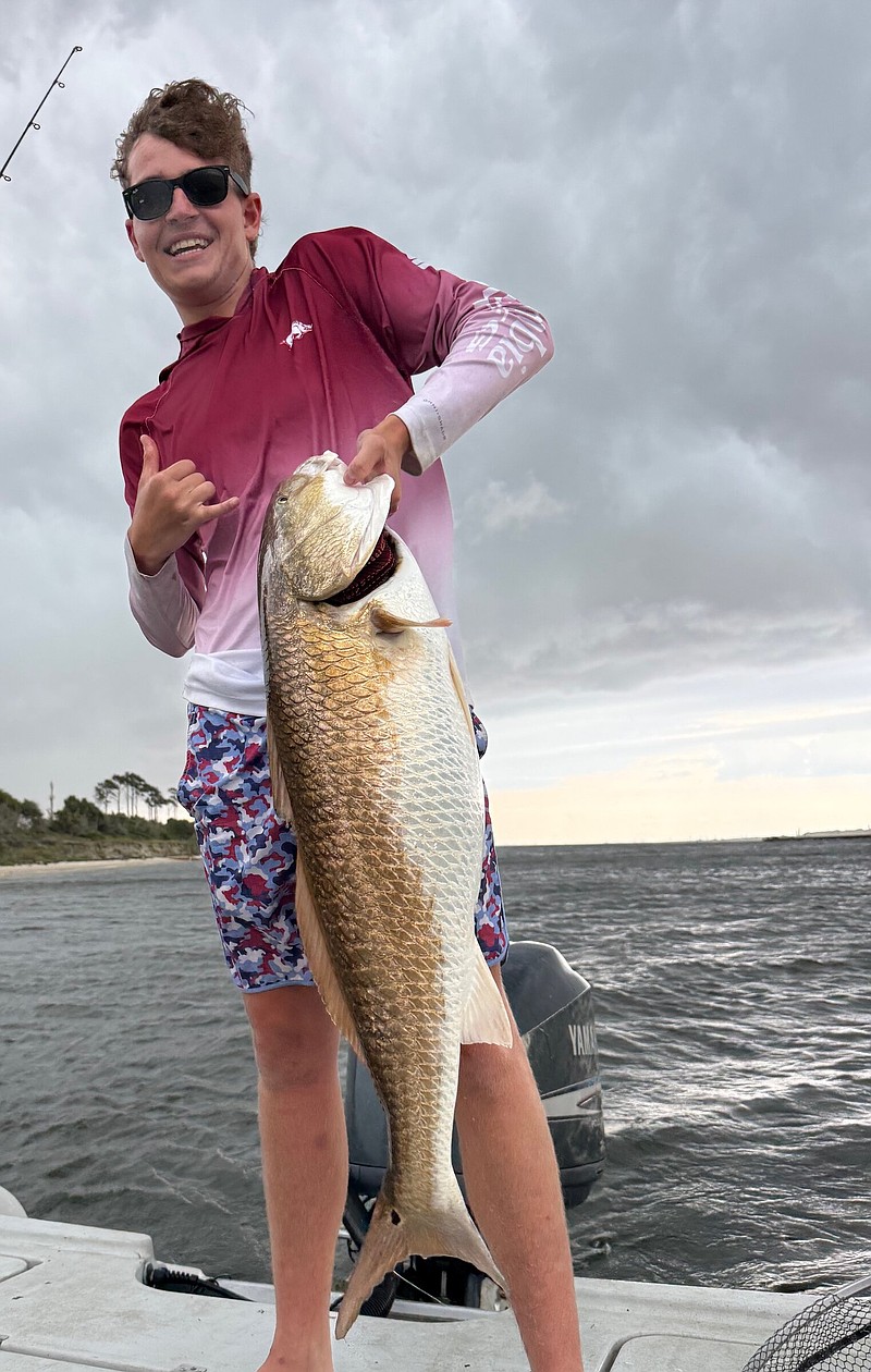 Patterson Johnson caught this 40-pound red drum in front of an approaching storm near Pensacola, Fla.
(Photo submitted by Jordan Johnson)