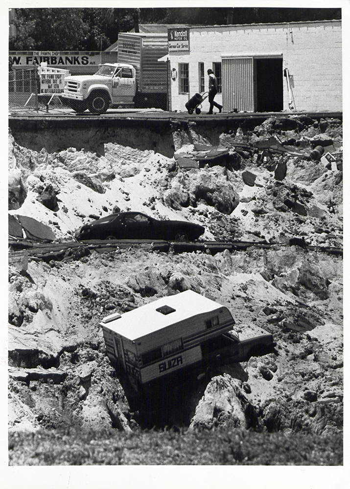 Photo of a trucktop camper on the side of the Winter Park sinkhole