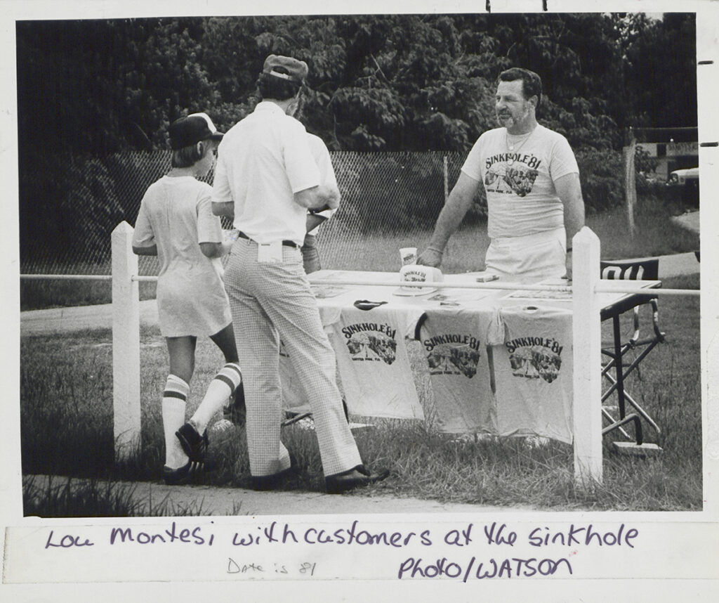 Lou Montesi sells “Sinkhole City” souvenirs near the sinkhole site during the summer of 1981.