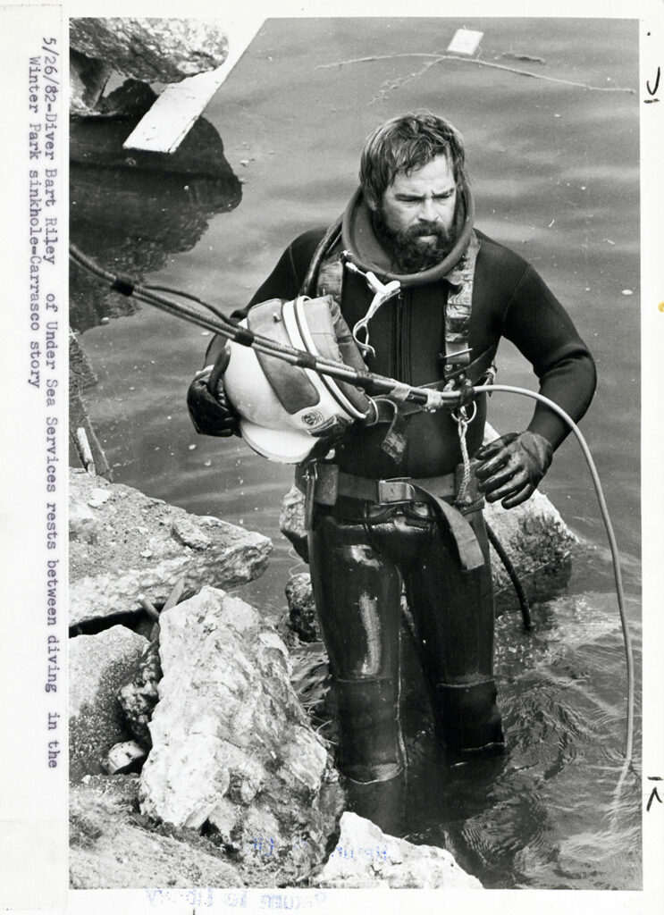 Scuba diver at the edge of the Winter Park sinkhole.