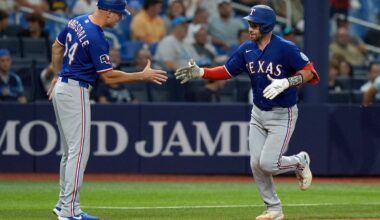 Texas Rangers' Austin Wynns celebrates his solo home run off Tampa Bay Rays pitcher Steven Matz with third base coach Corey Ragsdale (64) during the seventh inning of a baseball game Tuesday, July 28, 2026, in St. Petersburg, Fla. (AP Photo/Chris O'Meara)