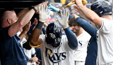 Tampa Bay Rays' Cedric Mullins is greeted in the dugout after hitting a home run during the eighth inning of a baseball game against the Texas Rangers, Thursday, July 30, 2026, in St. Petersburg, Fla. (AP Photo/Jason Behnken)