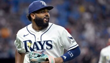 Tampa Bay Rays third baseman Junior Caminero watches a replay on his way to the dugout after the final out of the top of the seventh inning of a baseball game against the Seattle Mariners, Friday, July 10, 2026, in St. Petersburg, Fla. (AP Photo/Jason Behnken)