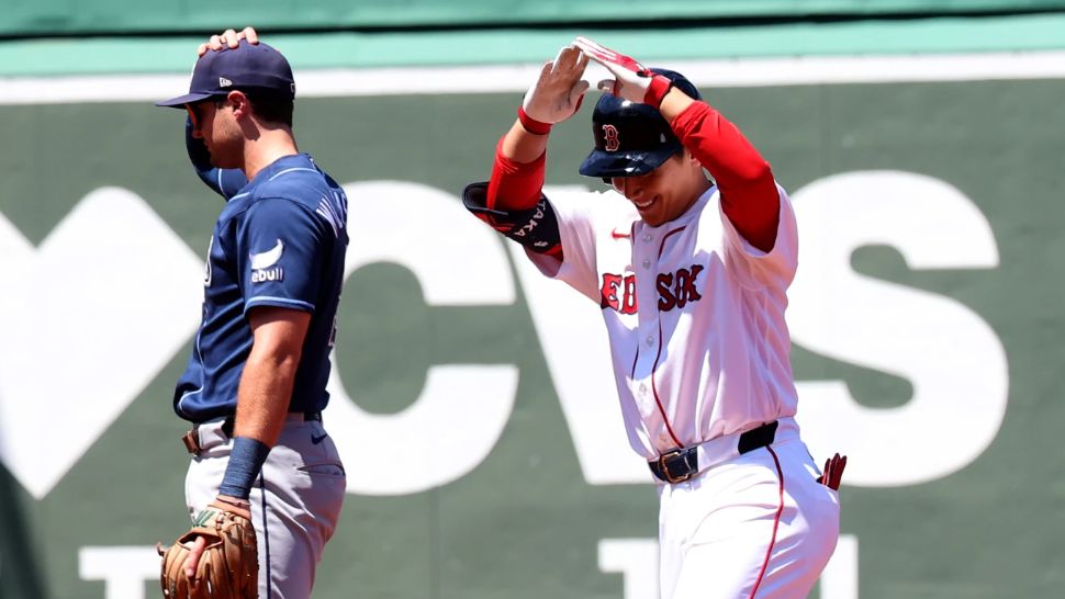 Boston Red Sox designated hitter Masataka Yoshida reacts after hitting a double during the second inning of the first baseball game of a doubleheader against the Tampa Bay Rays, Friday, July 17, 2026, in Boston. (AP Photo/Mark Stockwell)