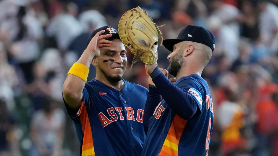 Houston Astros' Isaac Paredes, left, and Christian Walker celebrate after a baseball game against the Tampa Bay Rays Sunday, July 5, 2026, in Houston. (AP Photo/David J. Phillip)