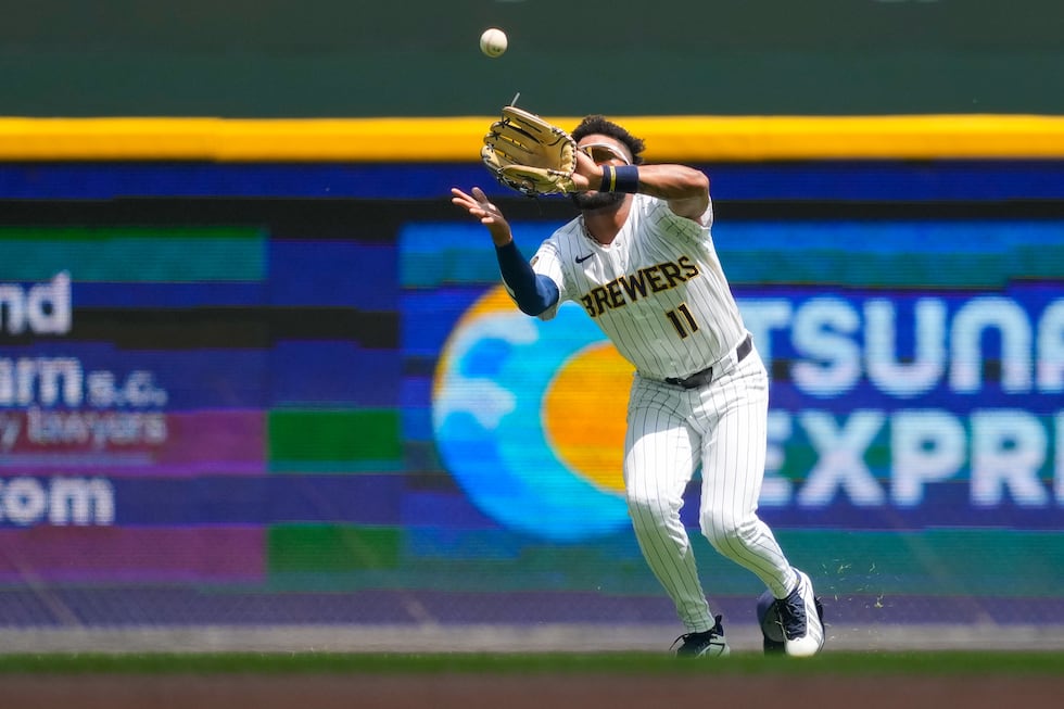 Milwaukee Brewers left fielder Jackson Chourio catches a fly ball hit by Miami Marlins' Liam...