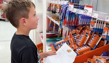 An student looks over a school supply list while shopping for back-to-school items. (Spectrum News 1/Saima Khan)
