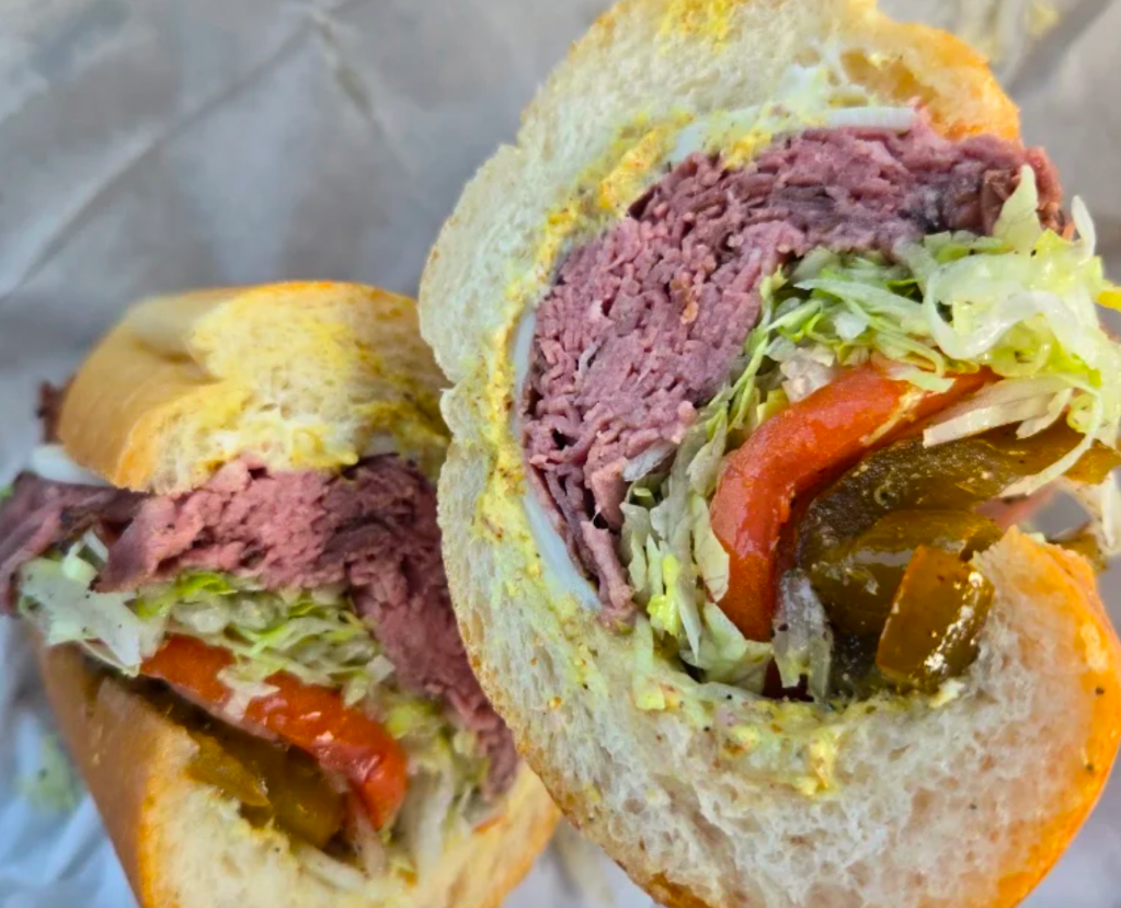 a pastrami sandwich with toppings