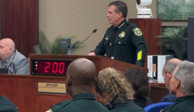 Sheriff John Mina stands at a podium as he reviews his budget request. (Spectrum News/Keith Landry)