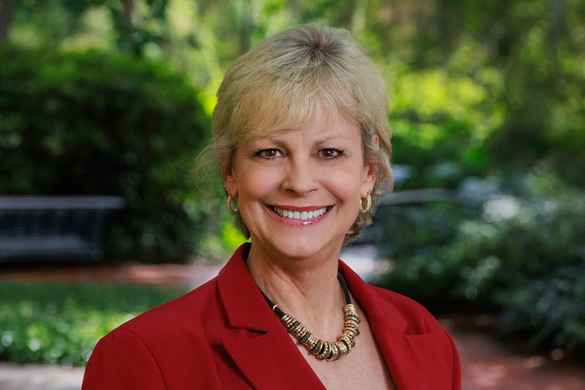 woman's headshot wearing a blazer