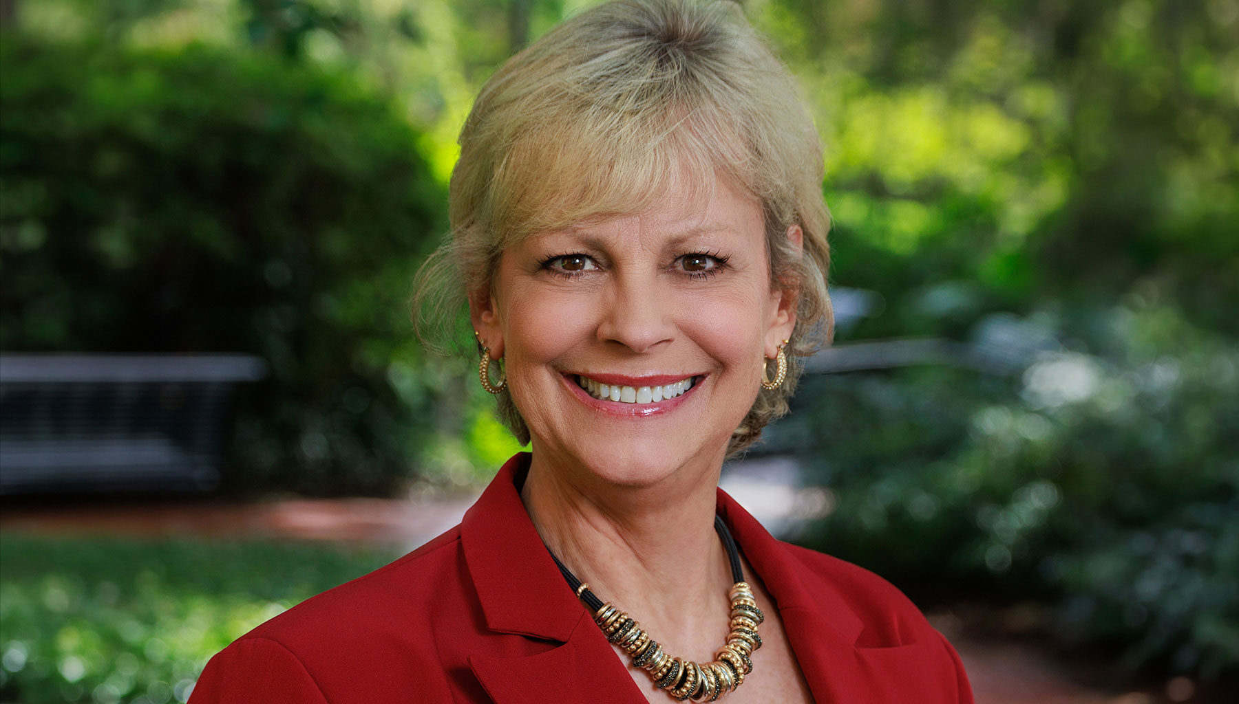 woman's headshot wearing a blazer
