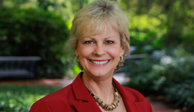 woman's headshot wearing a blazer