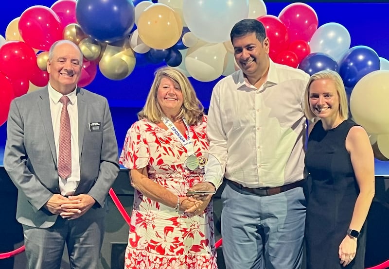 Elder Timothy Fagan stands with Kim Fredrick, Jay Patel and Brittany Hook as the Church is recognized during a sponsor banquet in Tampa, Florida, on June 29, 2026.