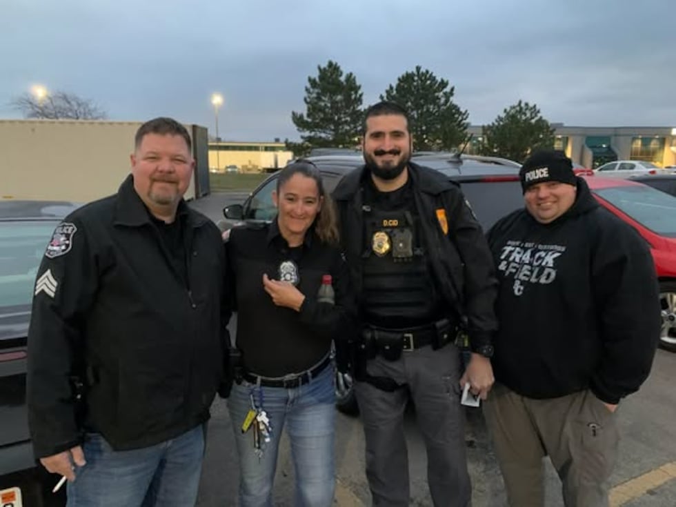 St. Marys Police Chief Derek Cid, second from right, said he would conclude his service in the...