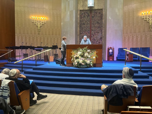 Jerry Deener, 82, reads from the Torah as the rest of the Eight-Three Club looks on. (B'nai Torah Congregation/Courtesy)