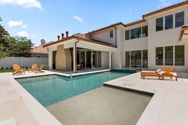 The heated, salt-water pool has an in-ground spa and tanning shelf. (Mohsin at Florida Home Photo)