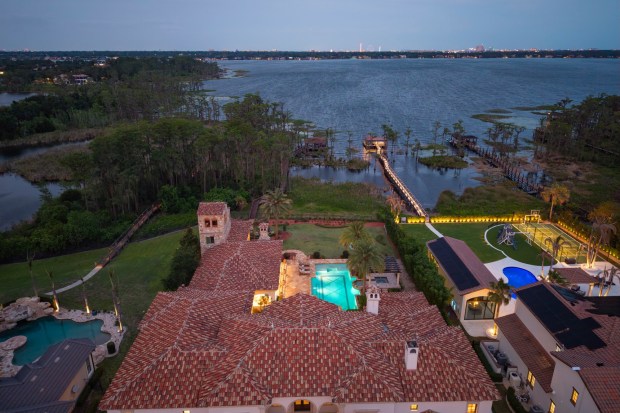 The lights of Orlando's I-Drive District and Icon Park can be seen across Lake Tibet. (Photo by Harvey Smith)