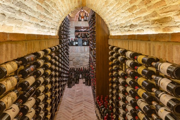 The climate-controlled wine cellar has a barrell-vaulted ceiling and holds hundreds of bottles. (Photo by Harvey Smith)