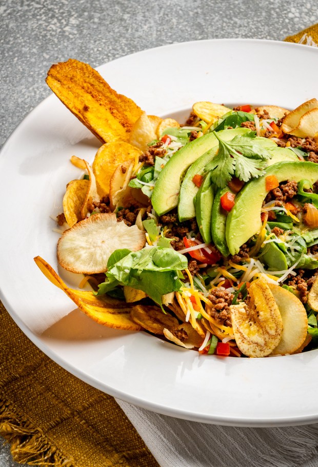 The lighter offerings, like this house salad, are served with fried plantain chips. (Courtesy of El Cilantrillo)
