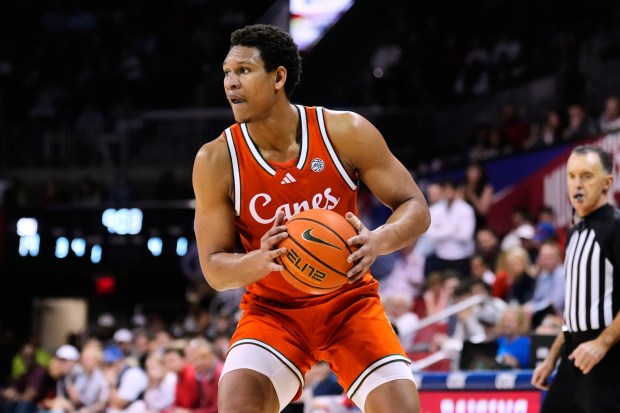 Miami forward Malik Reneau handles the ball during an NCAA college basketball game against SMU in Dallas, Wednesday, March 4, 2026. (AP Photo/Tony Gutierrez)