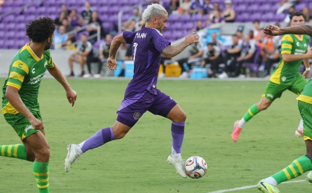 Orlando City player Antoine Griezmann (7) moves the ball toward the net during the Tampa Bay Rowdies at Orlando City Soccer friendly match at Inter&Co Stadium in Orlando on Wednesday, July 8, 2026. (Stephen M. Dowell/Orlando Sentinel)