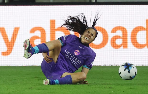 Pride player Jacqueline Ovalle grabs her leg as she falls during the Angel City FC at Orlando Pride soccer match in Orlando on Friday, April 3, 2026. Pride won the match 2-1. (Stephen M. Dowell/Orlando Sentinel)
