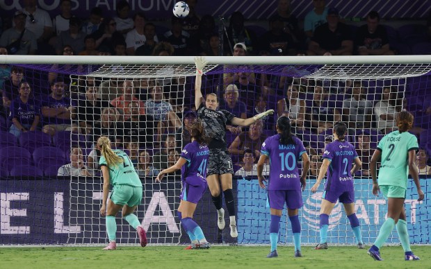Orlando goalkeeper Anna Moorhouse (middle) knocks the ball over the top bar during the Kansas City Current at Orlando Pride NWLS match at Inter&Co Stadium in Orlando on Friday, July 10, 2026. Orlando won the match 3-0. (Stephen M. Dowell/Orlando Sentinel)