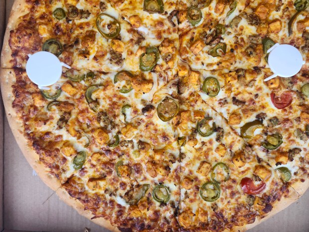 Chicken tandoori pizza from La Pinoz in Longwood. A nice balance of iconic presenation and Indian flavor. (Amy Drew Thompson/Orlando Sentinel)