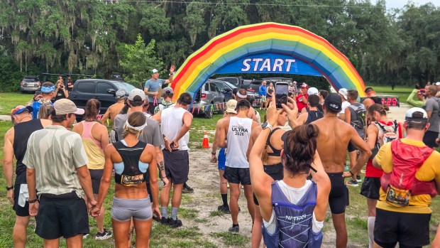 Runners line up at the start during the Skunk Ape Night Run in Green Swamp on July 18, 2026. (Patrick Connolly/Orlando Sentinel)