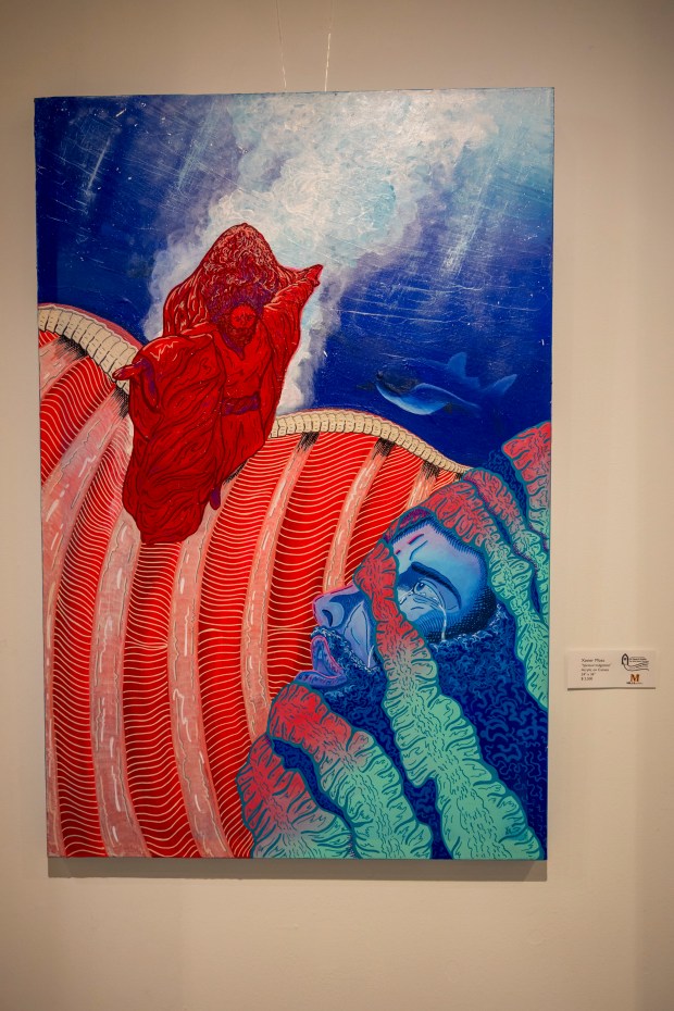 One painting by artist Xavier Moss depicts the story of Jonah and the big fish in his show, "Flesh & Faith: The Wild Meets the Way," at the Mills Gallery in Orlando on July 17, 2026. (Patrick Connolly/Orlando Sentinel)