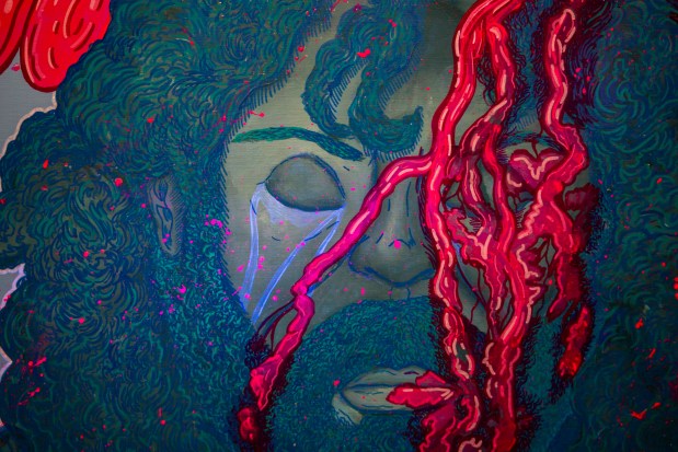 "Slain" is one work by artist Xavier Moss in his first solo show, "Flesh & Faith: The Wild Meets the Way," at the Mills Gallery in Orlando on July 17, 2026. (Patrick Connolly/Orlando Sentinel)