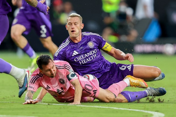 Inter Miami forward Lionel Messi (10) and Orlando City defender Robin Jansson (6) battle for the ball in the first half during an MLS soccer match against the Orlando City, Saturday, May 2, 2026, in Miami. (AP Photo/Chris Arjoon)