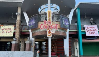 Entrance of the Red Coconut Club styled for HHN, featuring banners for “Annual Samhain Bash!” and “Welcome Pledges!”