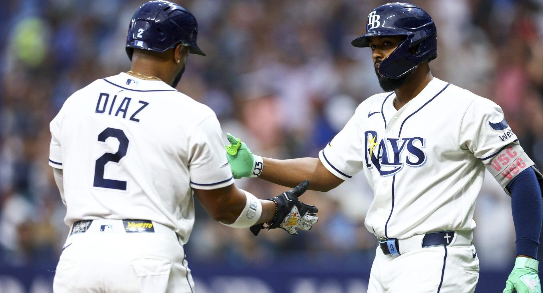 Jul 8, 2026; St. Petersburg, Florida, USA; Tampa Bay Rays third baseman Junior Caminero (13) greets designated hitter Yandy Diaz (2) after scoring a run against the New York Yankees in the third inning at Tropicana Field.