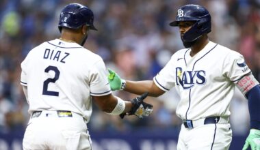 Jul 8, 2026; St. Petersburg, Florida, USA; Tampa Bay Rays third baseman Junior Caminero (13) greets designated hitter Yandy Diaz (2) after scoring a run against the New York Yankees in the third inning at Tropicana Field.
