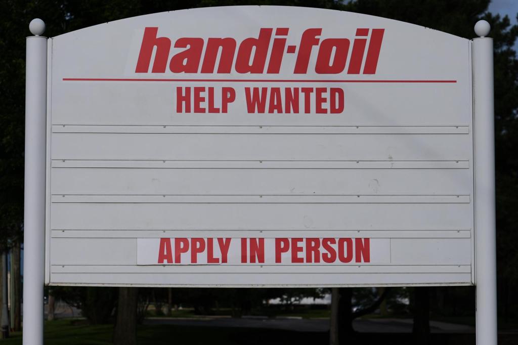 US jobless claims dipped modestly to 215,000 last week