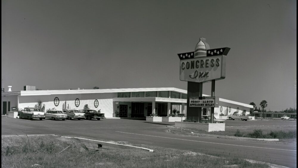 Congress Inn motel on North Dale Mabry Highway in Tampa in 1961, with its large roadside sign, parked cars and low-rise motel buildings.