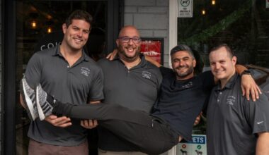 Four Cousin Vinny’s partners pose outside the Tampa restaurant. Title: Cousin Vinny’s partners